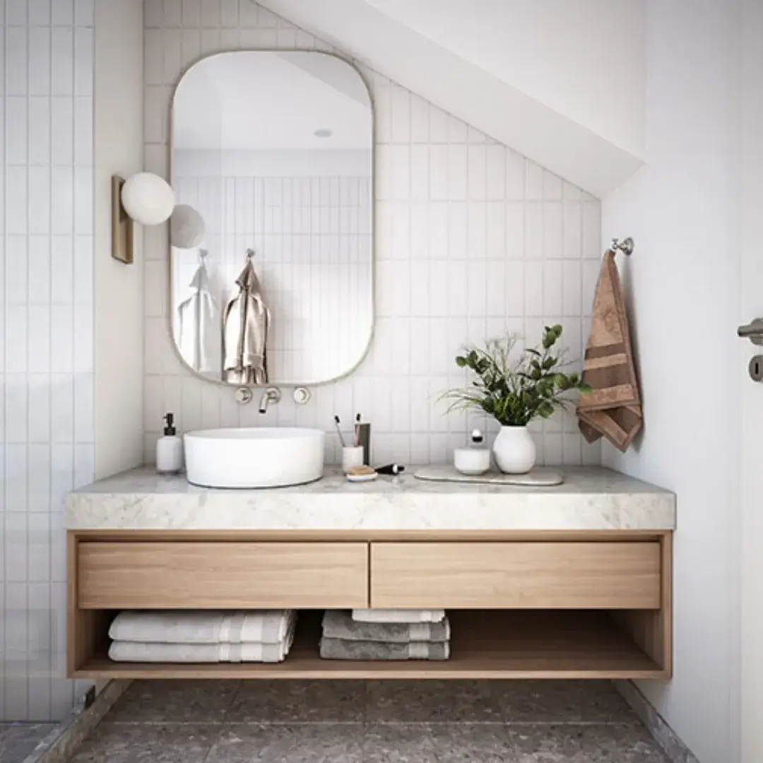 Scandinavian-style bathroom with a floating wooden vanity, marble countertop and soft neutral tones.